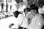 Men Resting On Park Bench